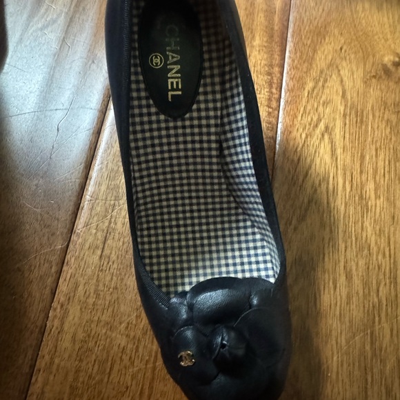 CHANEL Shoes - CHANEL Black Leather Camellia Ballet Flat with Gold CC Charm
